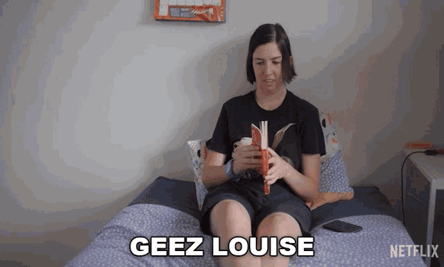 a woman is sitting on a bed reading a book with the words geez louise written on the bottom