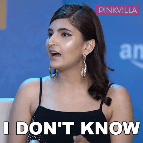 a woman says " i don 't know " while wearing hoop earrings