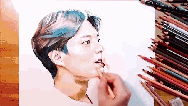 a drawing of a man with blue hair is being drawn on a piece of paper