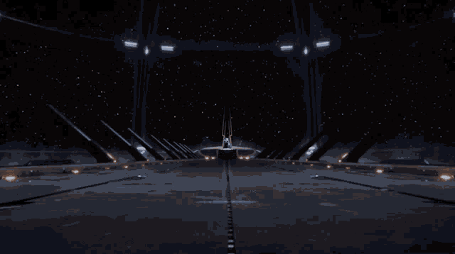 a couple of people standing on a bridge looking at a space ship