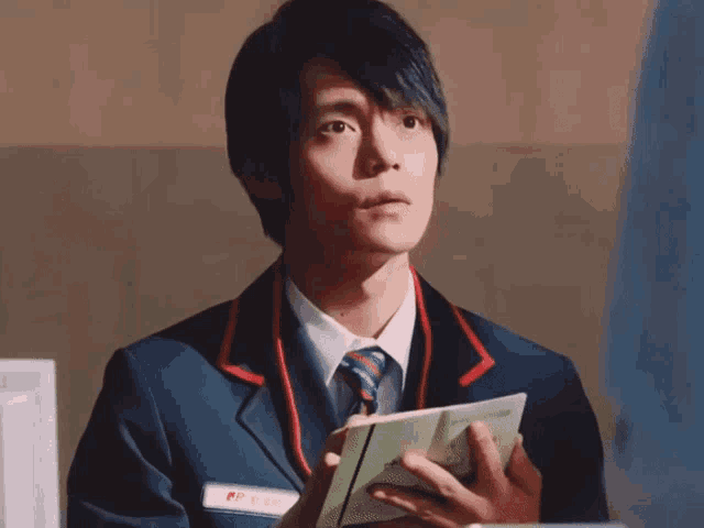 a man in a uniform with a name tag that says jp post