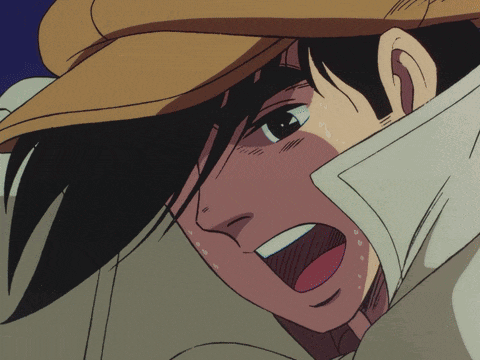 a close up of a man with his mouth open