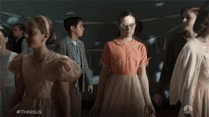a group of girls are dancing in a room with balloons and a nbc logo