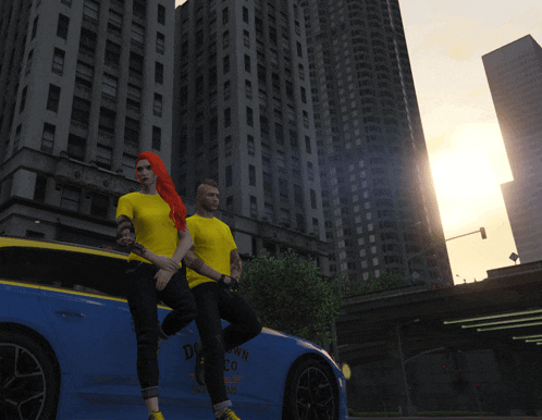 a man and a woman are sitting on a car that says downtown