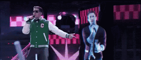a man in a green jacket with the letter c on it sings into a microphone