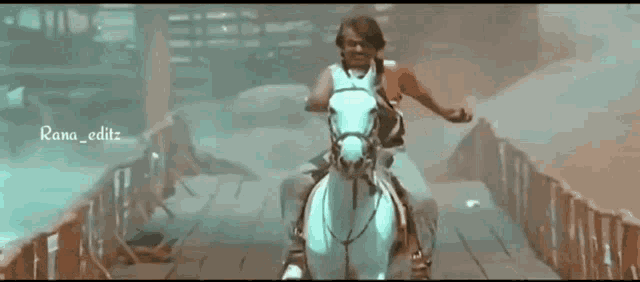 a man is riding a white horse across a bridge with rana_editz written on the bottom
