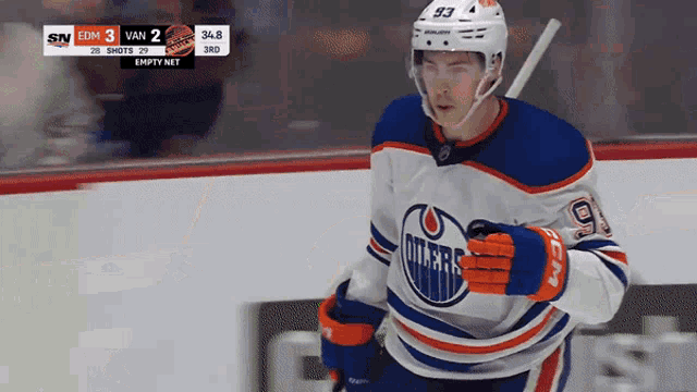 an edmonton oilers hockey player runs on the ice