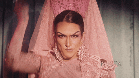a woman in a pink dress with the word pakita in the lower right corner