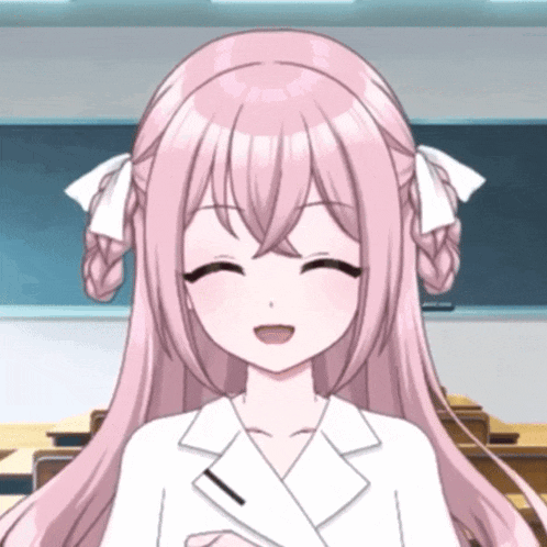a girl with pink hair is smiling in front of a blackboard in a classroom