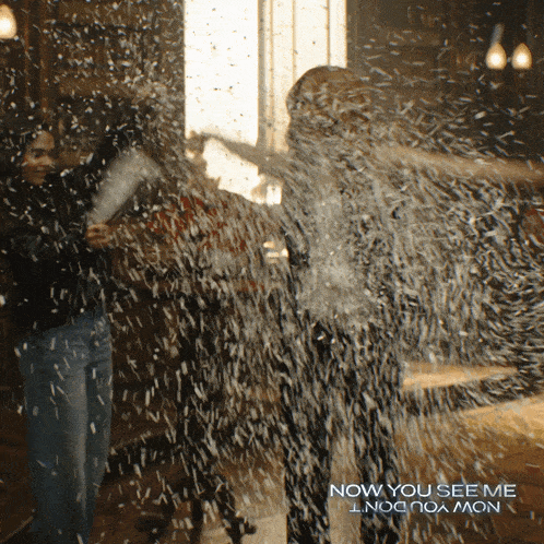 a poster for now you see me shows two people playing with snow
