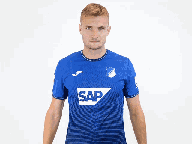 a man wearing a blue shirt that says sap