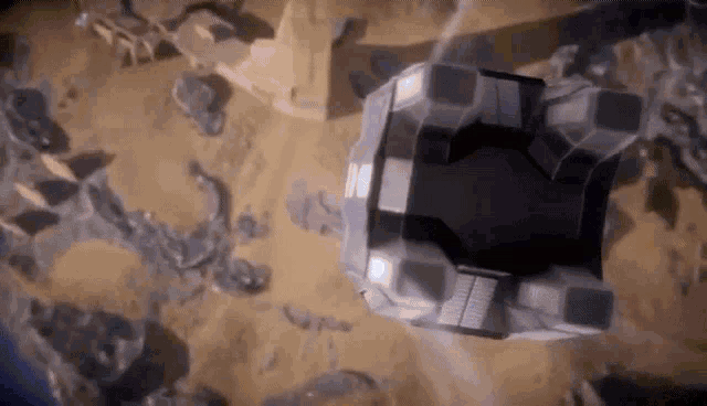 an aerial view of a space ship flying over a desert .
