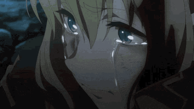 a close up of a person 's face with tears coming out of their eyes