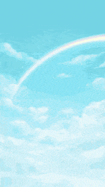 a woman wearing sunglasses and a flower in her hair stands in front of a blue sky and a rainbow