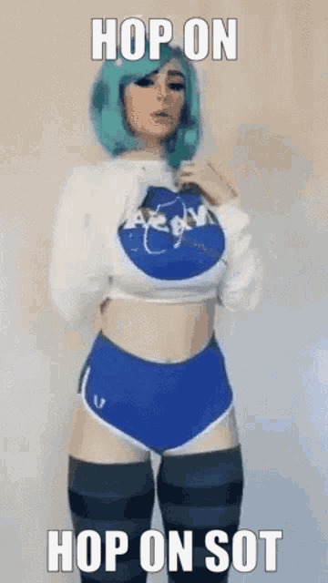 a woman with blue hair is wearing a nasa shirt