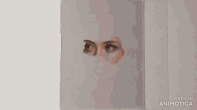 a person is painting a portrait of a woman with a brush .