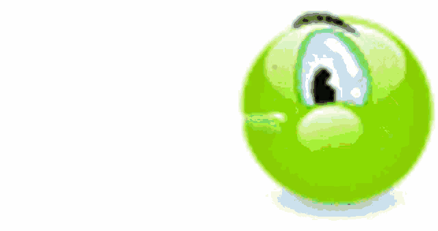 a green smiley face is vomiting yellow liquid on the ground .