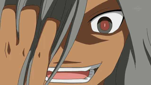 a close up of a cartoon character 's face with a red eye and the word tokyo on the bottom