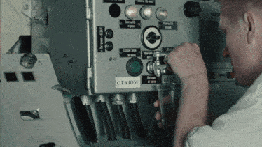a man is working on a machine with a label on it that says " cta3om "