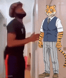 a man and a tiger are standing next to each other in a hallway