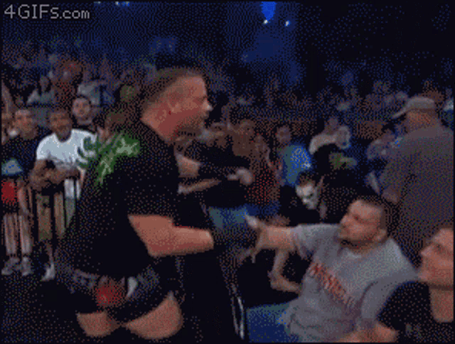 a man wearing a mask and a shirt that says sting on it