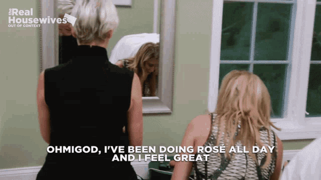 two women standing in front of a mirror with the words ohmigod i 've been doing rose all day