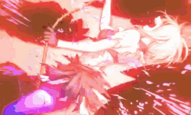 a girl is laying on the ground with a sword .
