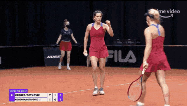 two female tennis players on a court with the word fila in the background