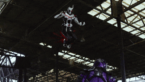 a purple robot is standing in a dark room surrounded by blood