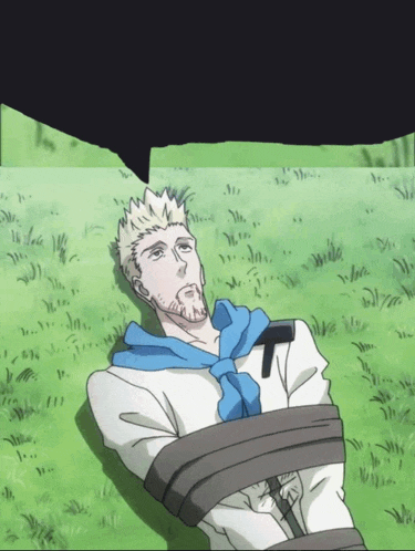 a man is tied up and laying in the grass with a speech bubble above him