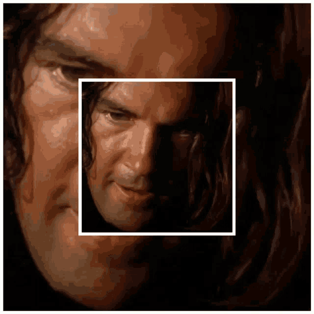a close up of a man 's face with a square frame around it