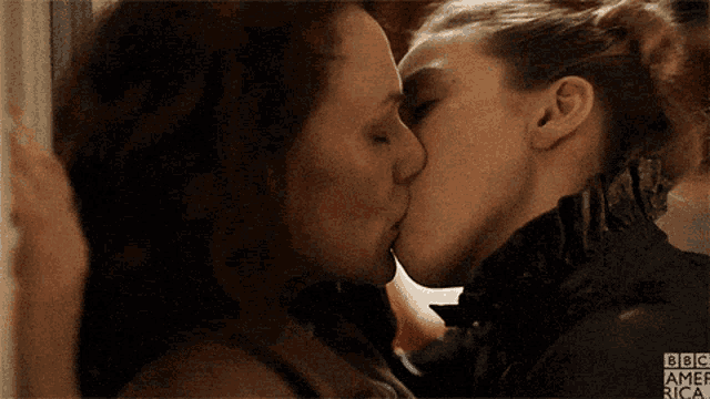 two women kissing with bbc america written on the bottom