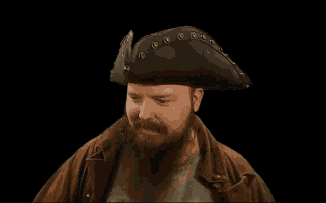a man with a beard wearing a pirate hat and a brown jacket
