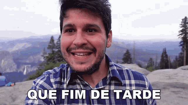 a man in a plaid shirt is smiling and says que fin de tarde