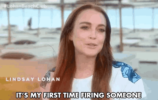 a woman with long red hair is saying it 's my first time firing someone