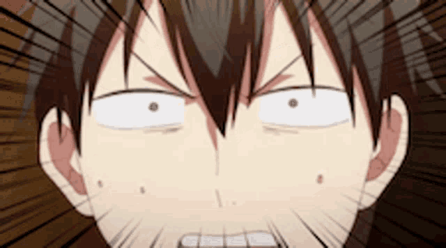 a close up of a person 's face with a shocked look on his face .