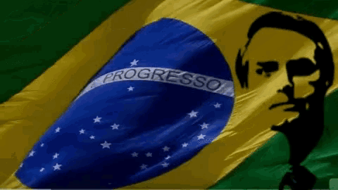 a silhouette of a man is behind a progresso flag