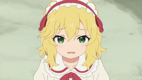 a girl with blonde hair and green eyes has a red headband on her head