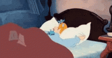 a cartoon of cinderella sleeping in a bed