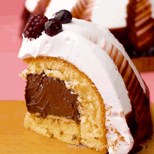 a slice of cake with a chocolate filling and white frosting