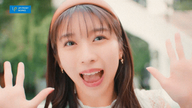 a girl with her mouth open and a headband that says upfront works on it