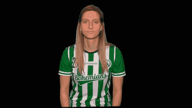 a woman wearing a green and white striped shirt with the word bohemians on it