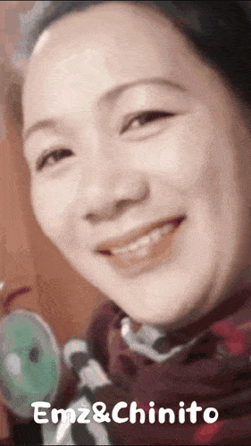 a close up of a woman 's face with the words emz & chinito on the bottom