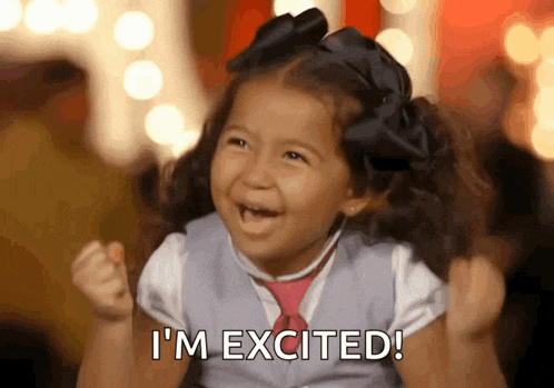 a little girl is making a funny face and says i 'm excited !