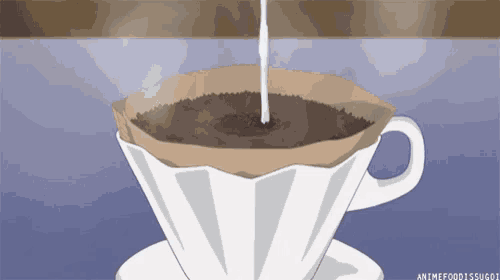 a cup of coffee is being poured into a coffee filter