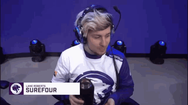 a man wearing headphones and a shirt that says lane roberts surefour on it