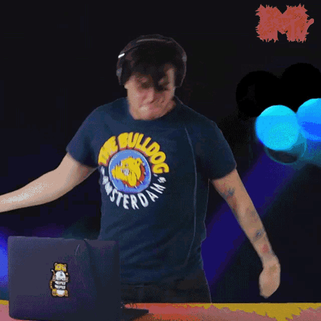 a man wearing a blue shirt that says the bulldog on it