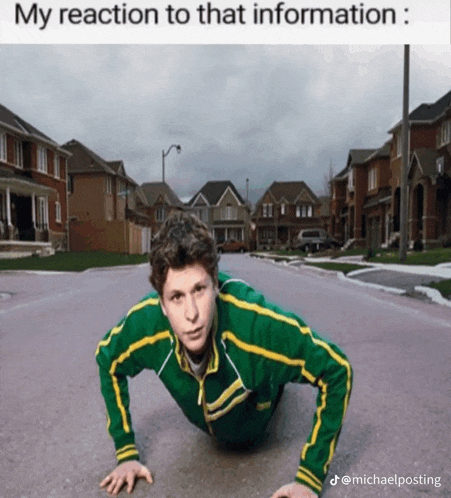 a man in a green and yellow jacket is doing push ups on the ground