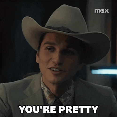 a man wearing a cowboy hat says " you 're pretty "