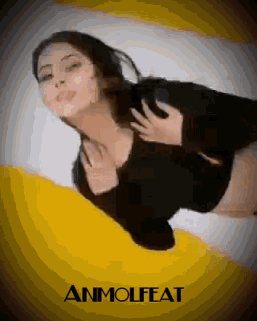a woman in a black top is laying on a yellow and white background that says anmolfeat